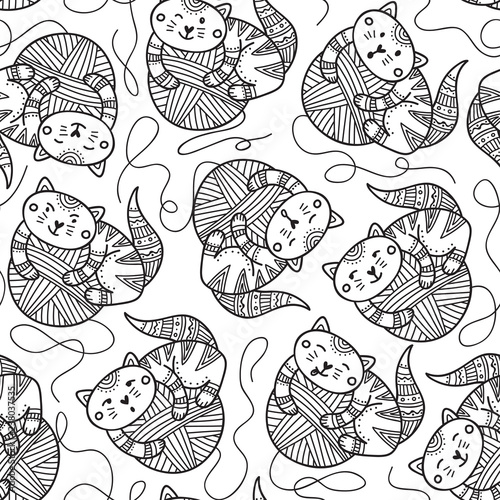 Vector seamless pattern with cute cats and yarn balls