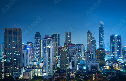 Cityscape night view of Bangkok modern office business building and high skyscraper in business district at Bangkok Thailand.