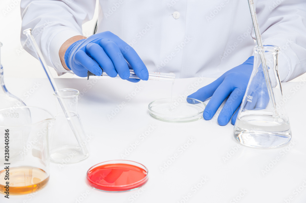 Fototapeta premium view of a human hands in the laboratory while performing experiments