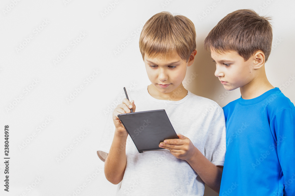 Kids learning to draw with graphic tablet and stylus pen Kids learning to draw with graphic tablet and stylus pen