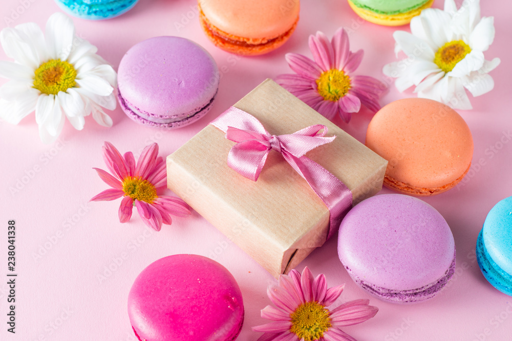 Photo of cake macarons, gift box, tea, coffee, cappuccino and flowers. Sweet romantic food macaroon concept. Morning breakfast and presents. Valentine's day concept. Photo of cake macarons, gift box, tea, coffee, cappuccino and flowers. Sweet romantic food macaroon concept. Morning breakfast and presents. Valentine's day concept.