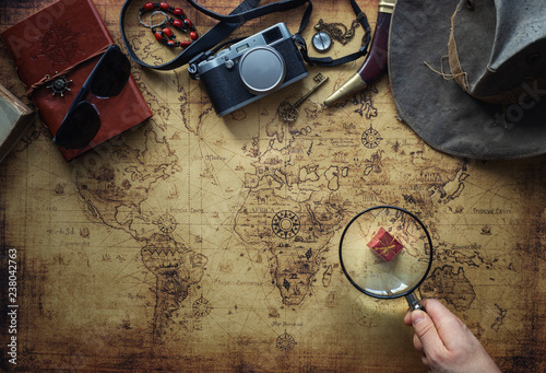 old map and vintage travel equipment / expedition concept or treasure hunt.