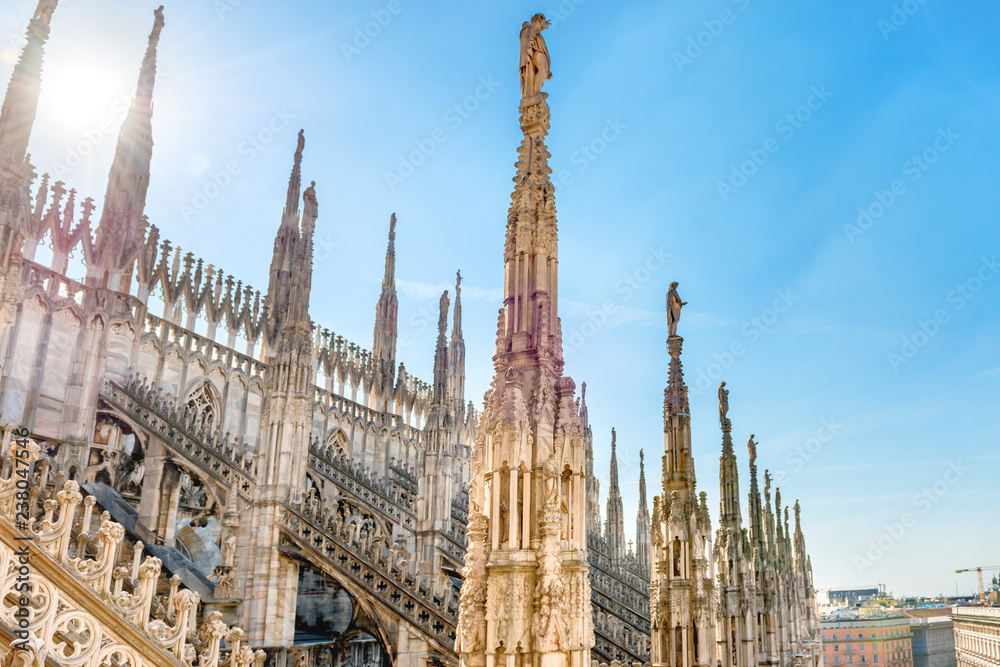 View from roof of Duomo gothic cathedral to piazza square in Milan