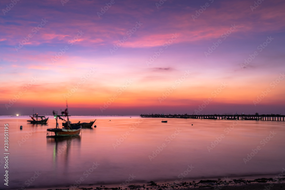 Long exposure, Beautiful sunset view with wooden jetty . Nature composition.