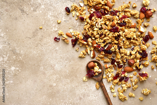 Tableau sur toile Homemade multicereal granola scattered on a slate table