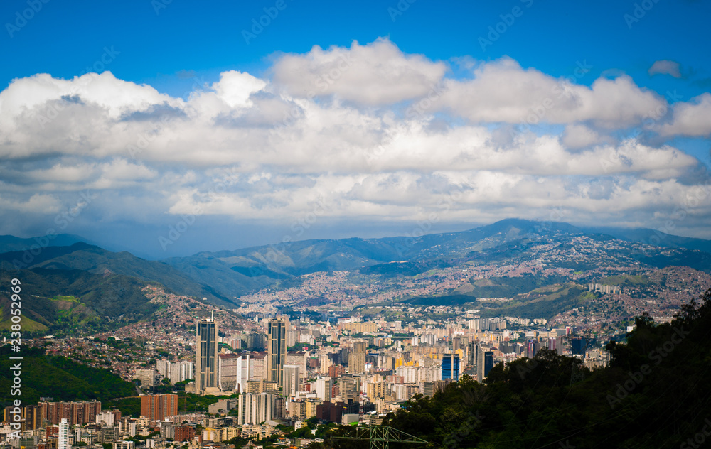 above view of Caracas city in Venezuela from Avila mountain during sunny cloudy summer day