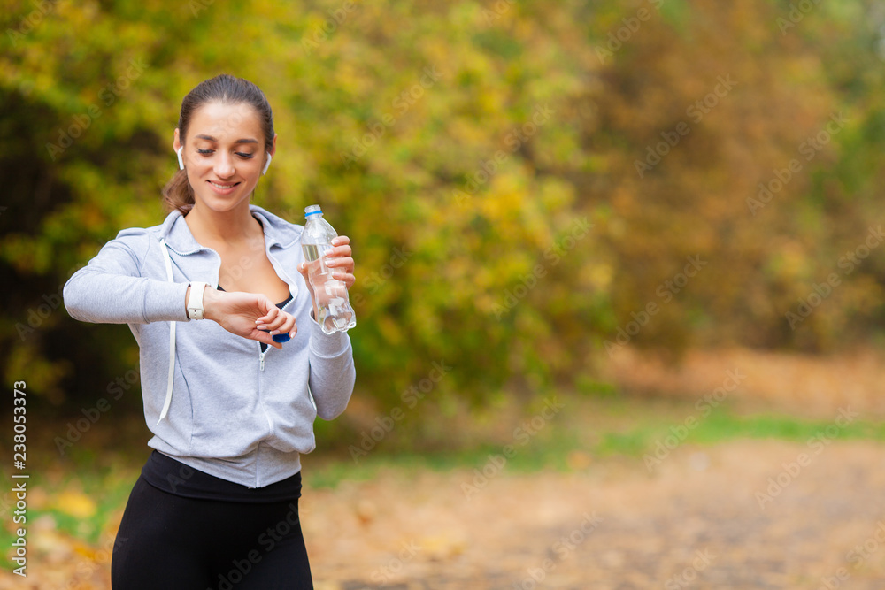 Runner drink water. Fitness, sport and healthy lifestyle concept Runner drink water. Fitness, sport and healthy lifestyle concept