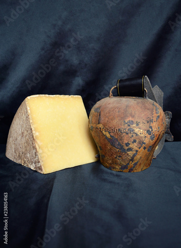 An Auvergne cheese (Cantal) with a cow bell