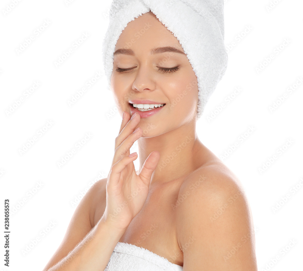 Portrait of young pretty woman with towels on white background Portrait of young pretty woman with towels on white background