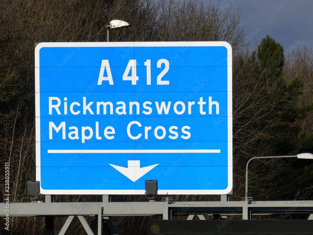 M25 exit sign at Junction 17 for Rickmansworth and Maple Cross A412