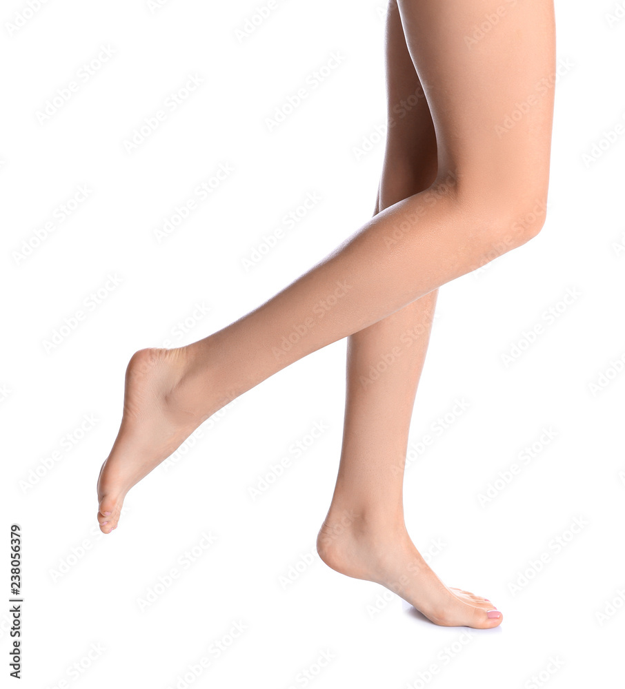 Woman with beautiful legs and feet on white background, closeup. Spa treatment Woman with beautiful legs and feet on white background, closeup. Spa treatment