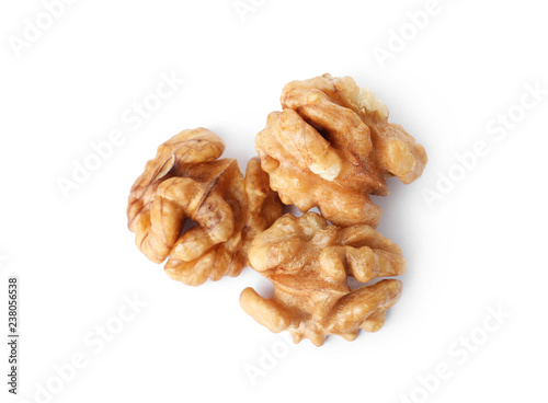 Tasty walnuts on white background, top view