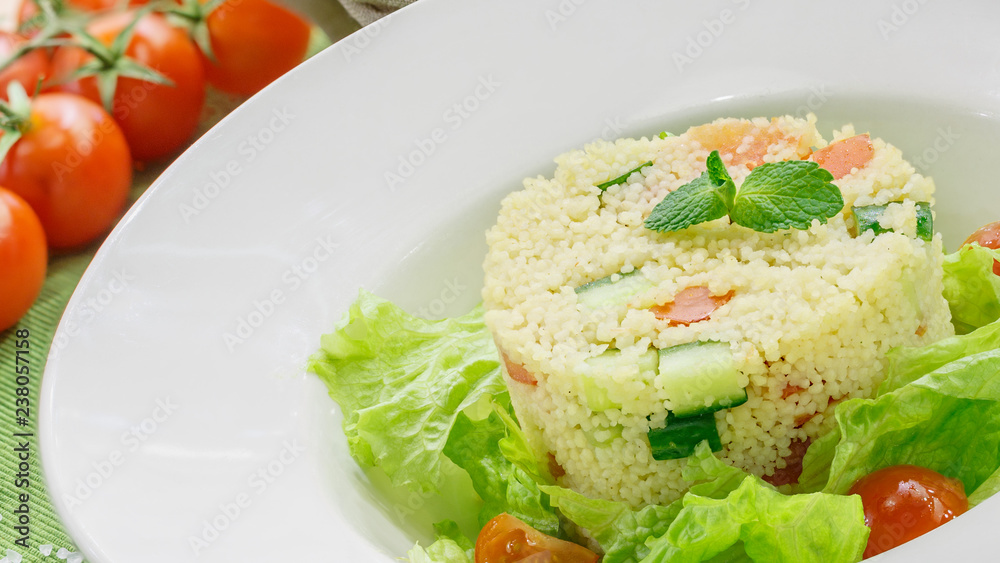 Salad with fresh vegetables in a white plate Salad with fresh vegetables in a white plate