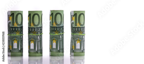 Принти на полотні Euro banknotes rolled up on a white background several hundred euros
