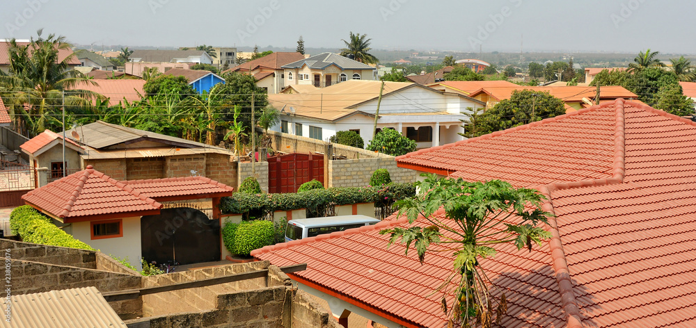 Modern residential buildings in Africa. Modern view. Suburb lifestyle in developing countries. Beautiful urban landscape. Top view. Wonderful houses with red tile roofs. Modern residential buildings in Africa. Modern view. Suburb lifestyle in developing countries. Beautiful urban landscape. Top view. Wonderful houses with red tile roofs.