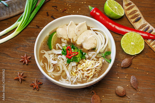 Chinese, Vietnamese soup, tom yam, pho, on wooden background, top view