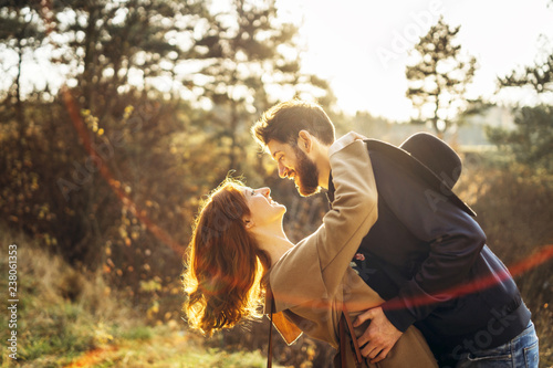 Happy young romantic couple spend time together outdoor.