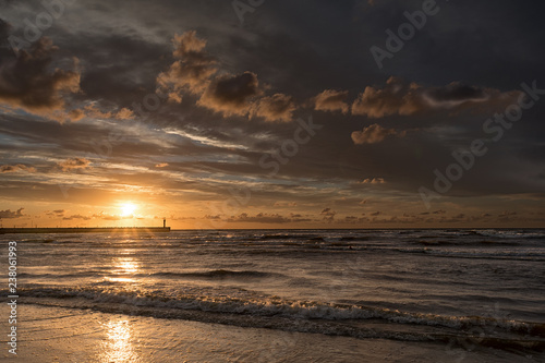 Sunset in Leba sun  mole and lighthouse  Poland