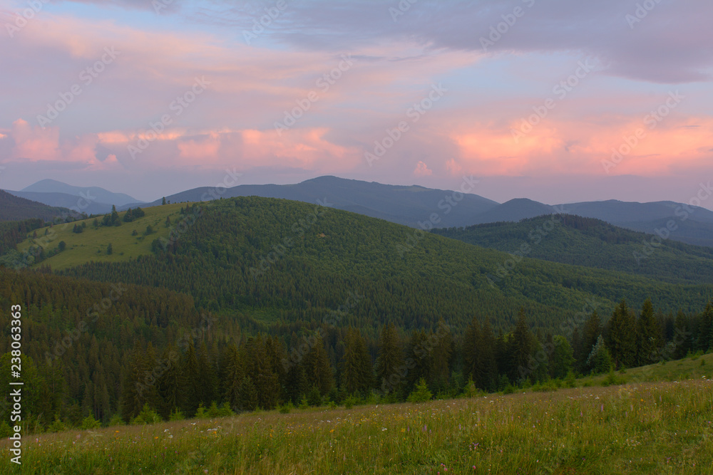 Sunrise in the mountains in the summer.