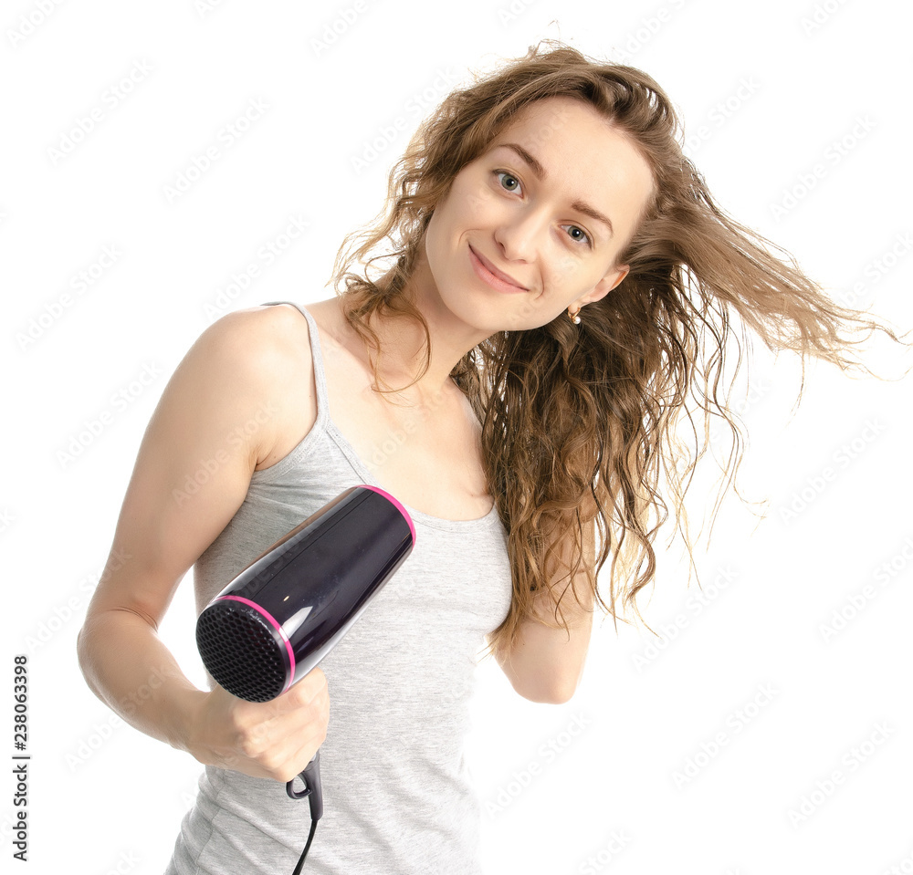 Beautiful woman beauty fashion dries hair a hair dryer on white background isolation Beautiful woman beauty fashion dries hair a hair dryer on white background isolation
