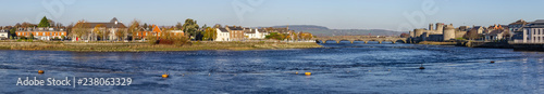 Panorama of Castle, stone bridge and Shannon river photo
