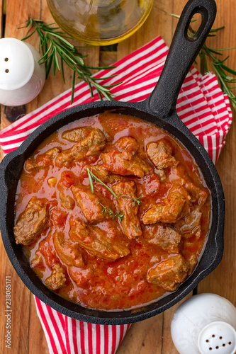 Beef stew with tomato sauce and cream photo