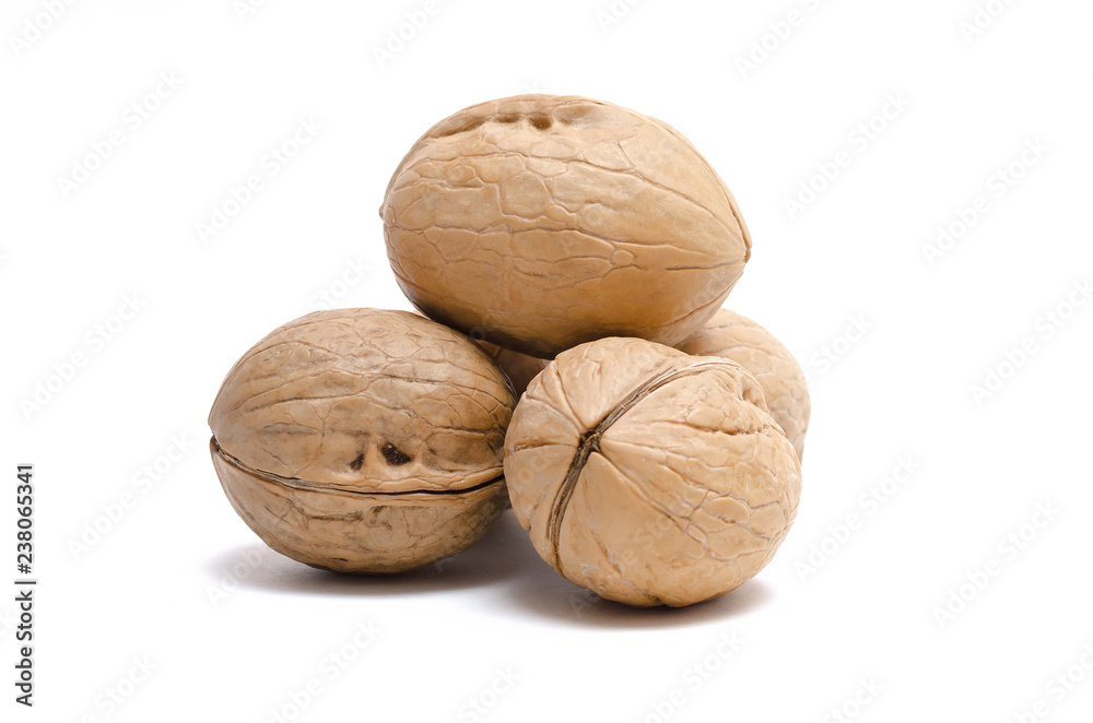 Heap of walnuts isolated on the white background. Heap of walnuts isolated on the white background.
