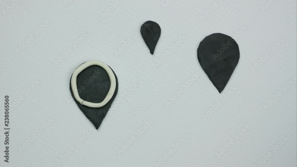 Black signs of location on the white background. Stop motion