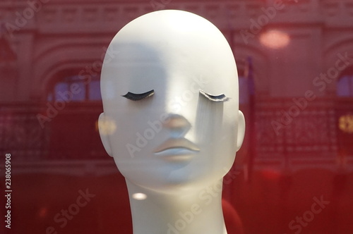 mannequin's white head with long eyelashes