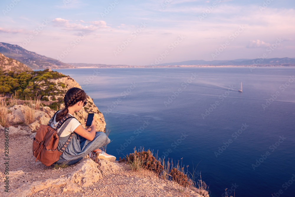 Fototapeta premium Young beautiful girl traveling along the coast of the Mediterranean Sea.