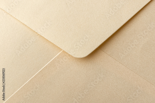 Abstract background in light brown color. Detail envelope close up. Copy space