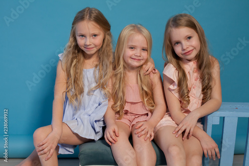 three beautiful little girls dresses fashion portrait sisters