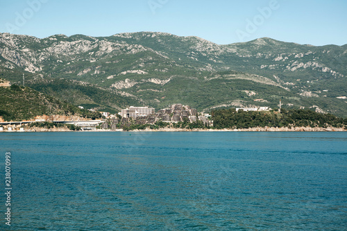 Beautiful view of the landscape of Montenegro. Sea and mountains. Buildings in the distance.