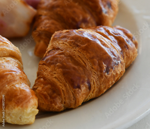 A Several delicious croissants on a plate