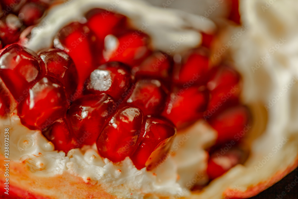 Red background of grain red grenades. Big ripe red granets or garnets. Vegetarian concept, organic vitamins. Organic and benefit garnet fruit. Red background of grain red grenades. Big ripe red granets or garnets. Vegetarian concept, organic vitamins. Organic and benefit garnet fruit.