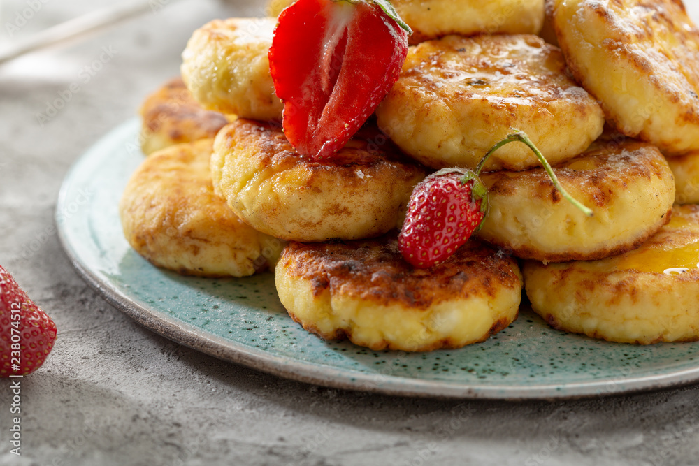 Cottage Cheese fritters with berry close-up