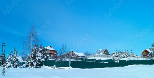 Landscape with cottage in rural terrain in winter © ovcerleonid