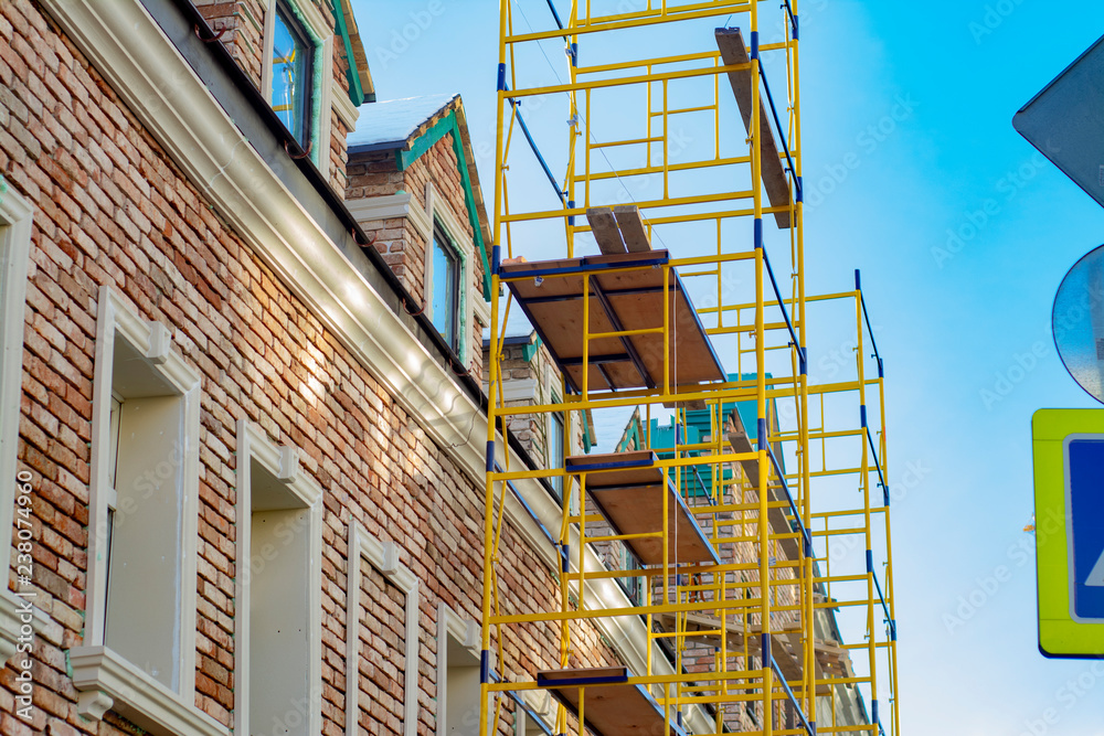 Scaffolding on the background of an old building