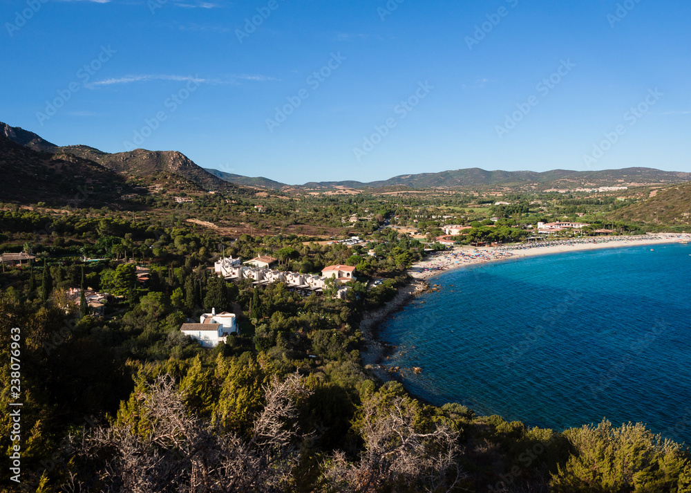Typical view of Sardinia with Mediterranean vegetation and blue sea.