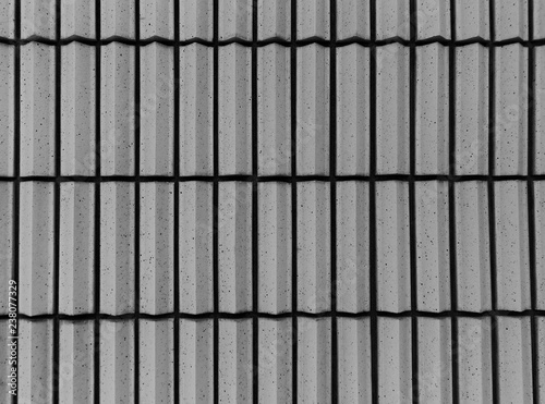 Striped ribbed wall building in grey tones for abstract background or texture