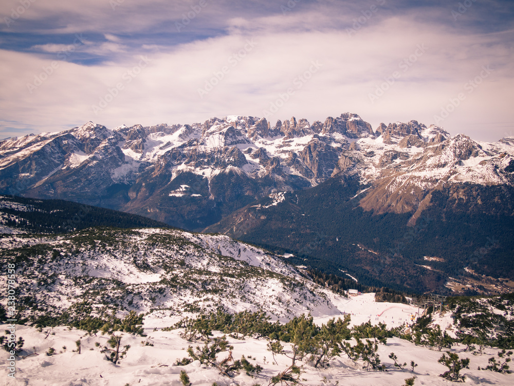 Alpine mountain range covered with snow. Winter landscape.