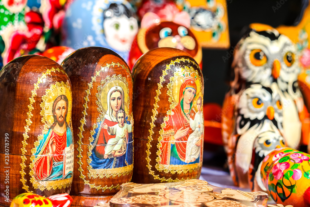 Fototapeta premium Traditional handicraft wooden souvenirs at street gift store near complex
