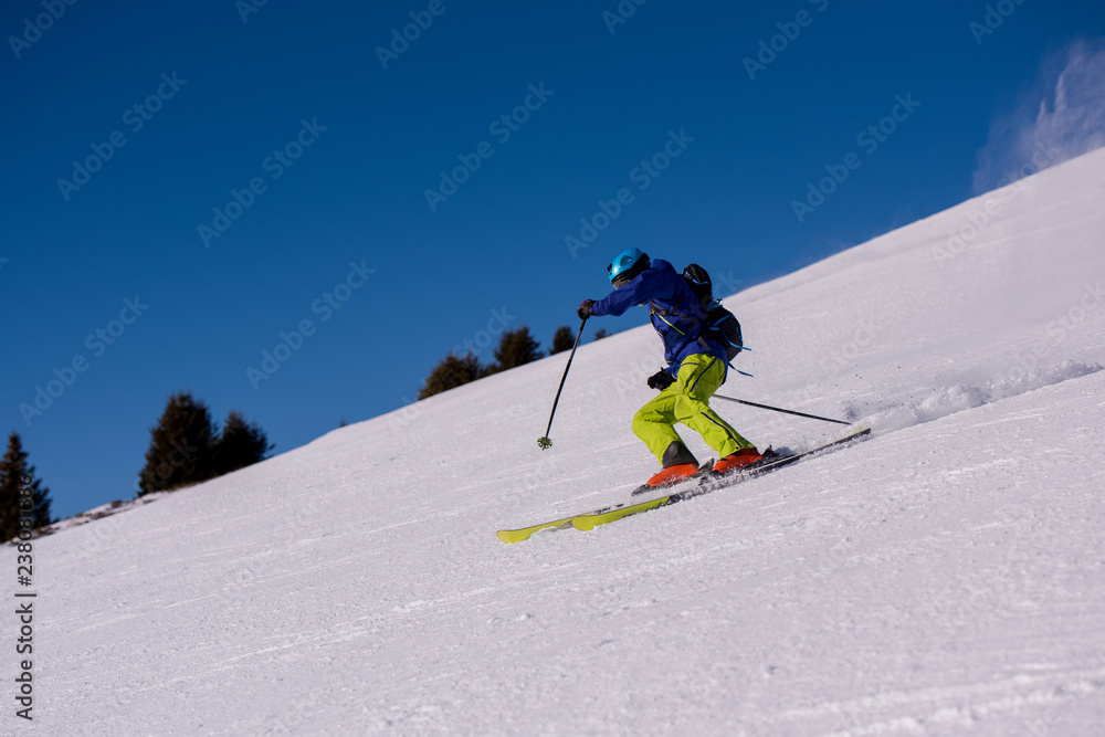 Skier having fun while running downhill Skier having fun while running downhill