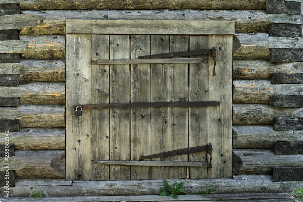 Abandoned barn vintage wooden door. Old photo of rustic house entrance
