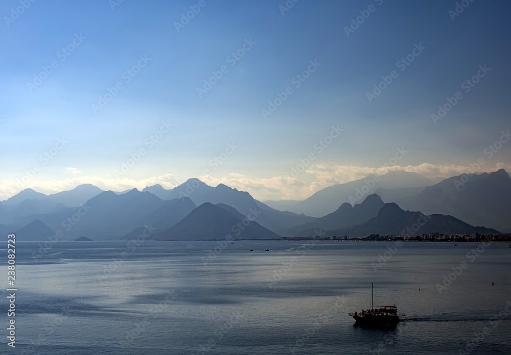 yacht sea mountains clouds