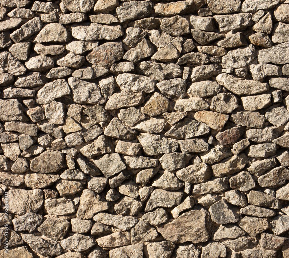 Dry old stone wall texture background close up Dry old stone wall texture background close up