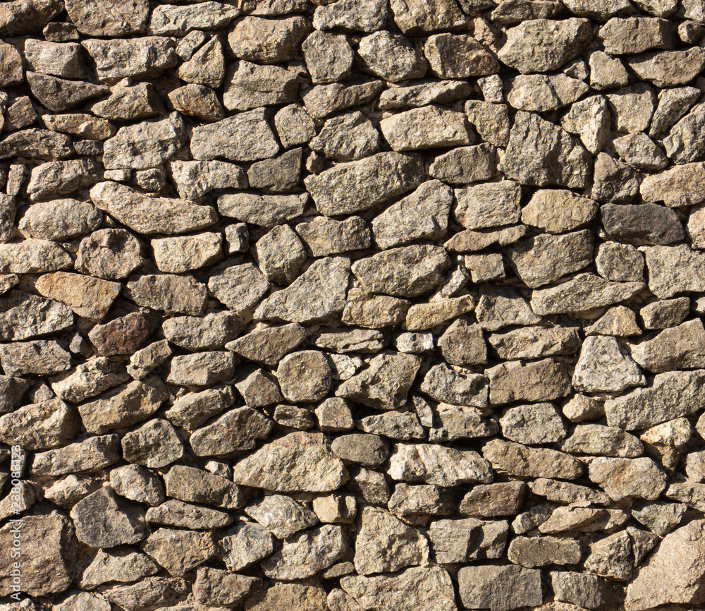 Dry old stone wall texture background close up Dry old stone wall texture background close up