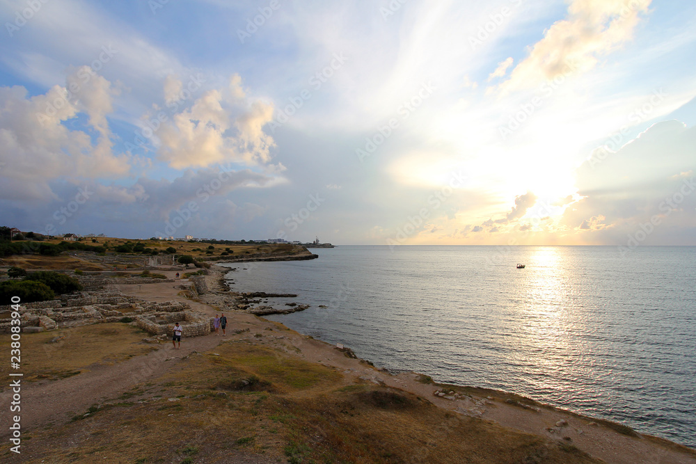 View of the ruins of Ancient Chersonesos and Black sea at sunset. Picturesque landscape. Sevastopol, Crimea, Russia