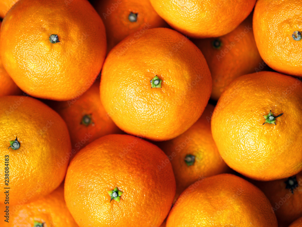 Tangerines macro. Fresh mandarin oranges fruit. Sweet juicy vitamin surface, vegetable market. Lots of tangerine Tangerines macro. Fresh mandarin oranges fruit. Sweet juicy vitamin surface, vegetable market. Lots of tangerine