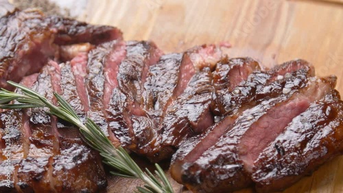 Cooking concept. Grilled marinated beef flank steak on wooden board